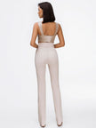 beige crop top and high waisted trousers
