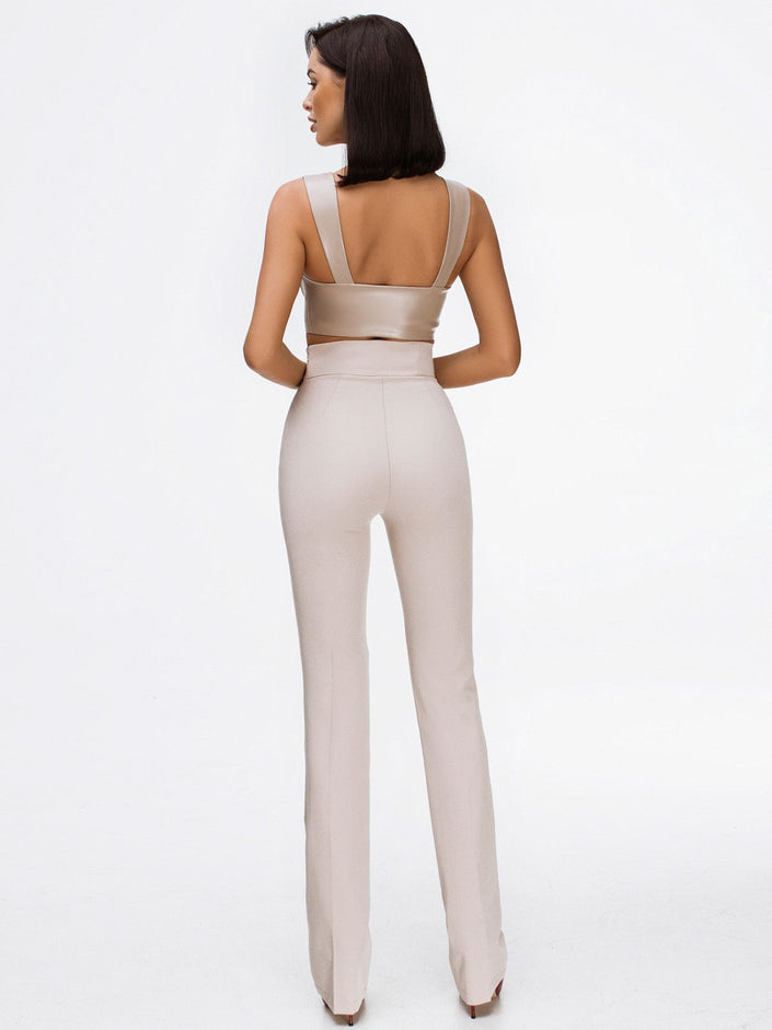 beige crop top and high waisted trousers